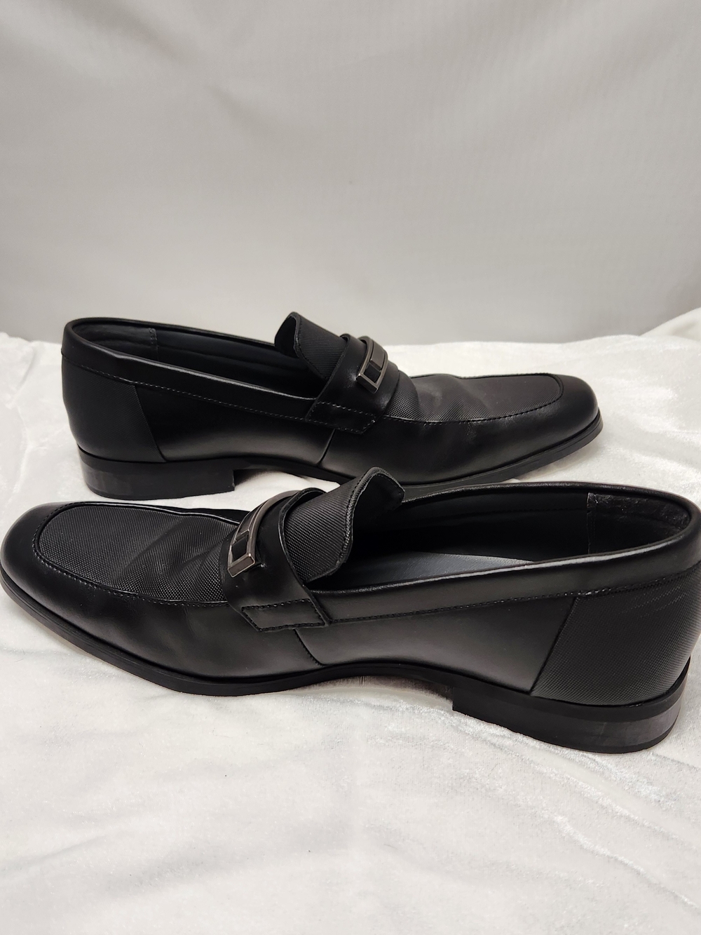Calvin Klein Men's Black Leather Slip-On Loafers with Metal Accent